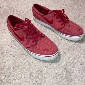 Worn Nike Janoski shoes (gym red)